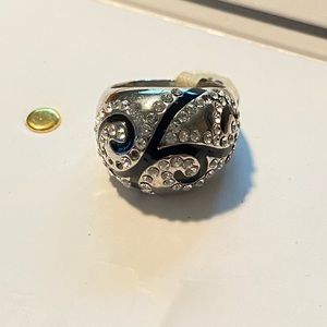 Well made costume silver ring with Black scrolls